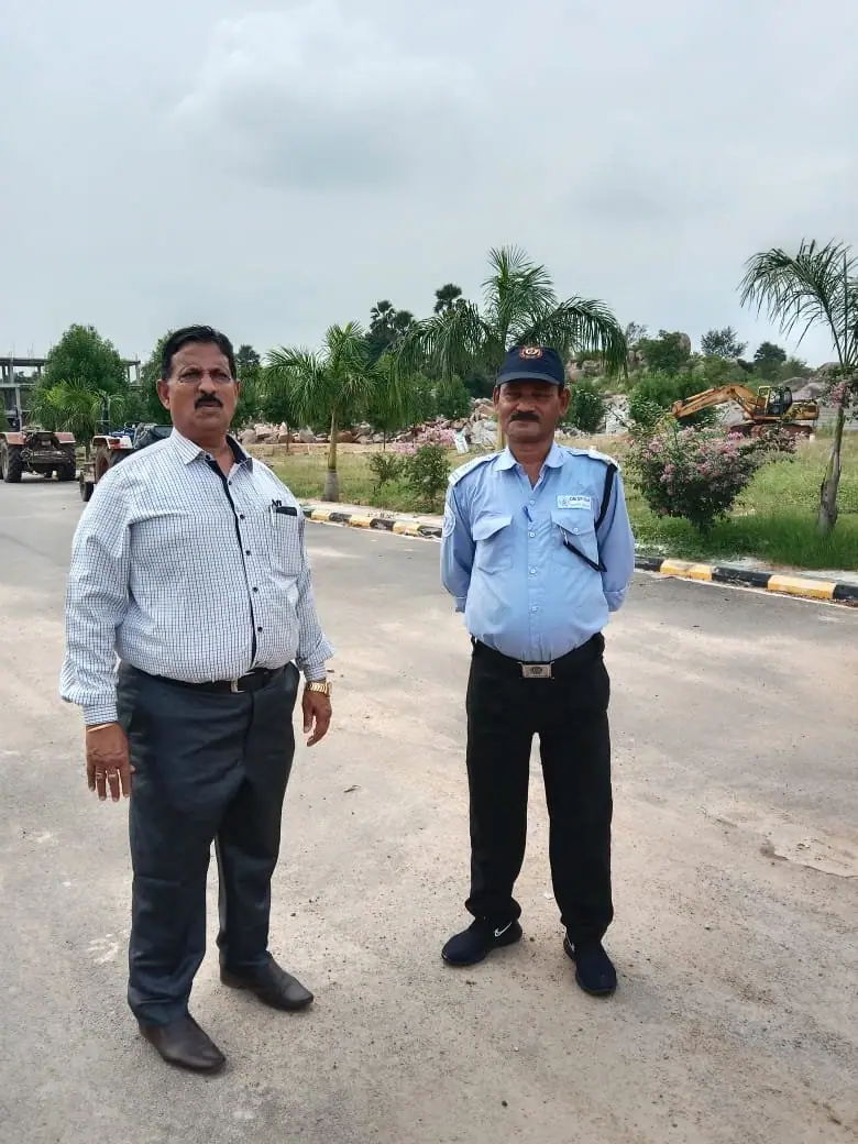 Field officer inspecting a security guard on duty